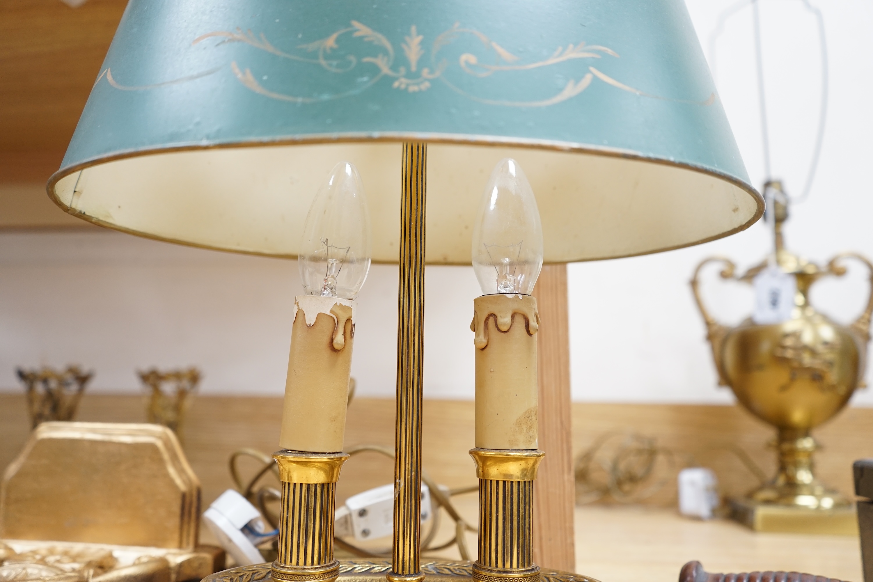 A French two light brass table lamp with toleware shade, 42cm high. Condition - some ware to toleware shade